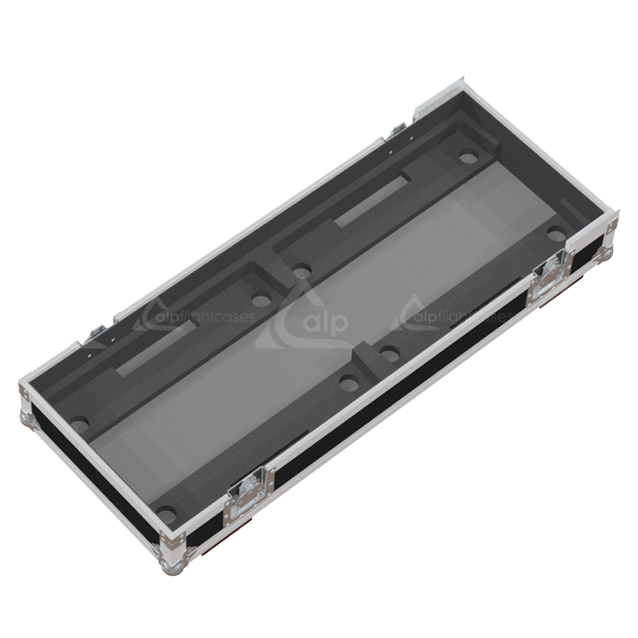 Empty interior of the flight case for 2x NEXO MSUB12 showing precision CNC-cut foam for subwoofer protection