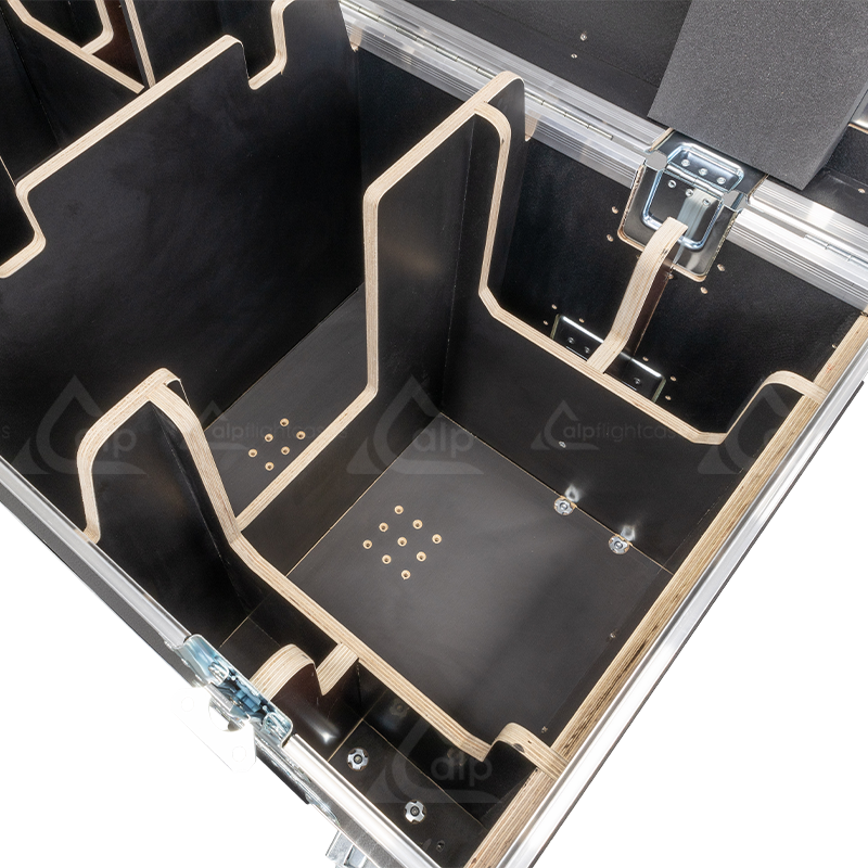 Close-up detail of the internal components, locking mechanisms, and specialized padding inside the flight case for CM motors.