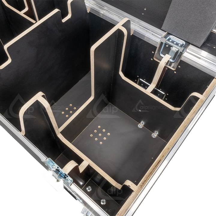 Close-up detail of the internal components, locking mechanisms, and specialized padding inside the flight case for CM motors.