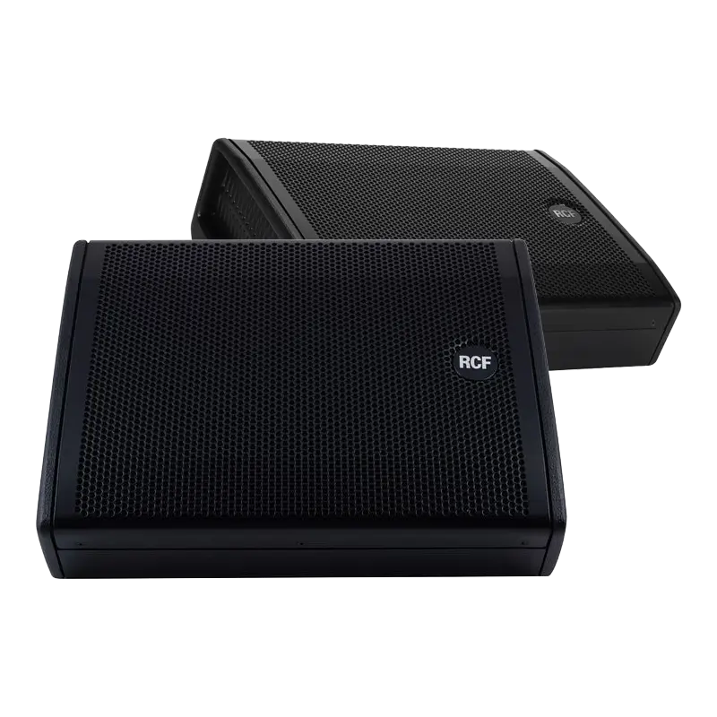 Pair of RCF NX 12-SMA active coaxial stage monitors showing the low-profile design and front grille