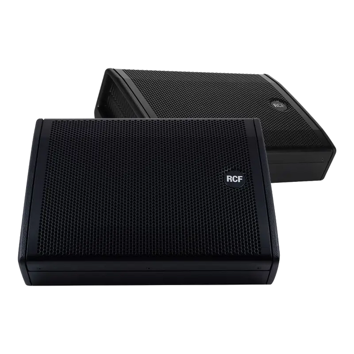 Pair of RCF NX 12-SMA active coaxial stage monitors showing the low-profile design and front grille