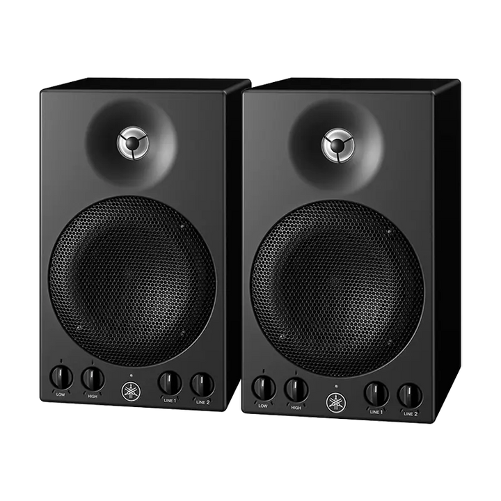 Pair of Yamaha MSP3 powered studio monitors showing front control knobs and compact design